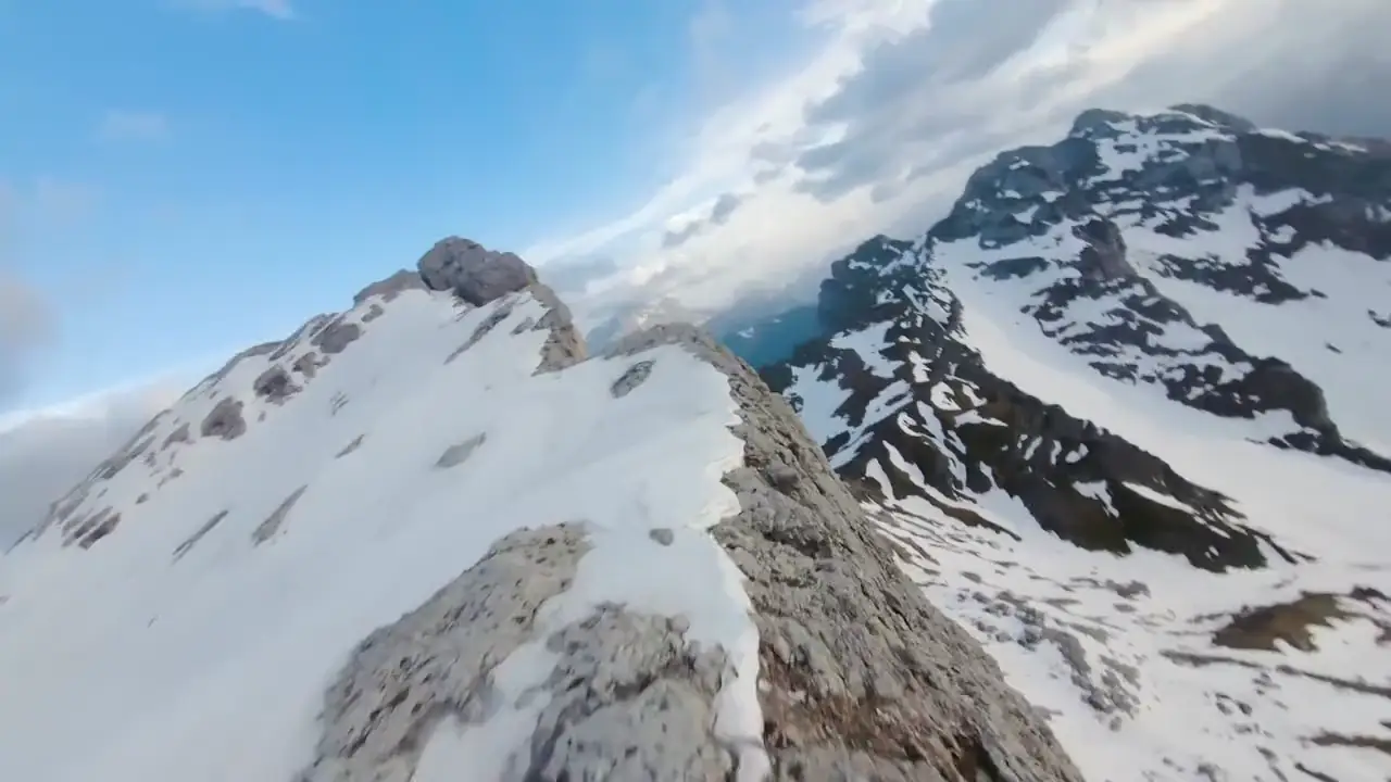 Drone flight over snowy Himalayan ridges
